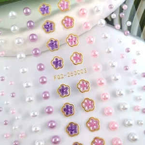 Detailed view of face rhinestones and pearl stickers for stunning festival eye makeup.