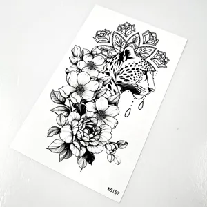 Detailed view of black and white leopard and floral temporary tattoo sticker sheet.