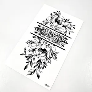 Close-up detail of black and white floral temporary tattoo sheet with geometric pattern.