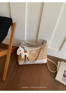 Chic woven shoulder bag for women, retro straw crossbody bag with chain and cute horse charm.