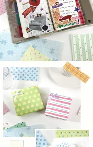 Nahansicht von bunten DIY Tagebuch Dekorationspapier mit niedlichen Mustern und Stickern.
