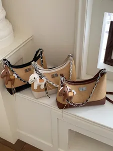 Straw woven shoulder bag with chain strap and cute horse charm, three color options displayed.