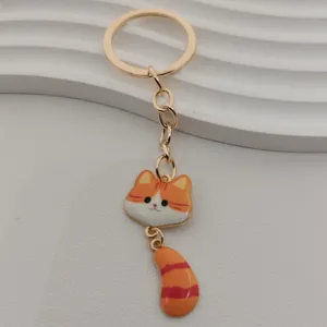 Cute metal cat keychain with striped tail and big face pendant, stylish bag key ring accessory.
