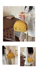 Minimalist lightweight yellow cloth shell bag, stylish crossbody and shoulder bag for summer.