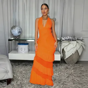 Detailed view of the elegant orange halter maxi dress, showcasing layered ruffles and design.