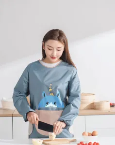 Kitchen waterproof long sleeve apron detail, featuring cute cartoon pattern and front pocket design.
