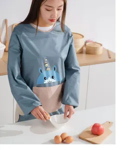 Waterproof long sleeve kitchen apron for women, cute cartoon deer pattern with wipe pockets.