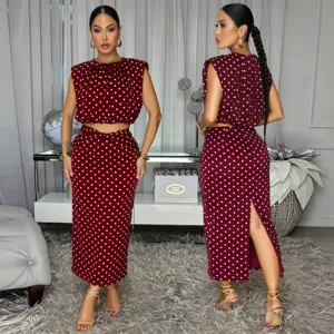 Burgundy polka dot sleeveless top and midi skirt two-piece set, chic summer fashion outfit.