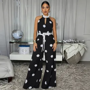 Black white polka dot halter jumpsuit, sleeveless design, high waist, wide leg style.