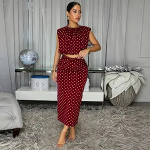Burgundy polka dot sleeveless top and midi skirt set, elegant two-piece outfit for women.