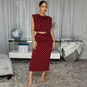 Burgundy polka dot sleeveless top and midi skirt set, elegant two piece outfit detail.