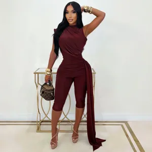 Sleeveless slim fit ruched jumpsuit with elegant side drape, stylish women's apparel detail.