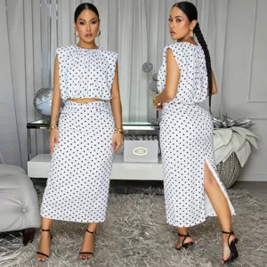 Detail view of the elegant black and white polka dot sleeveless top and skirt set.