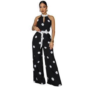 Chic black and white polka dot halter jumpsuit, sleeveless design with waist tie for women.