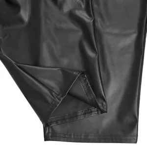 Black faux leather garment detail close-up showing fine stitching and smooth texture quality.