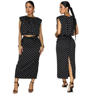 Black and white polka dot two piece crop top and midi skirt set, elegant sleeveless outfit.