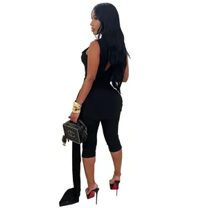 Detailed view of women's black sleeveless jumpsuit with stylish ruched streamer and slim fit.
