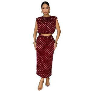 Burgundy polka dot sleeveless crop top and midi pencil skirt two-piece outfit style.