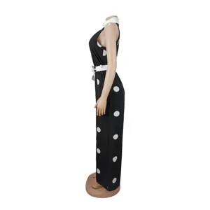 Black and white polka dot halterneck sleeveless jumpsuit with white collar and belt.