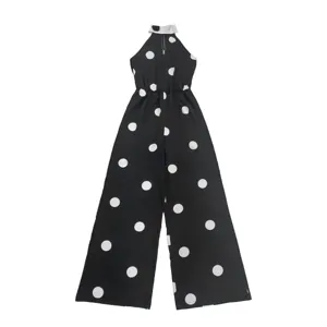 Black and white polka dot halter neck sleeveless wide leg jumpsuit fine detail view.