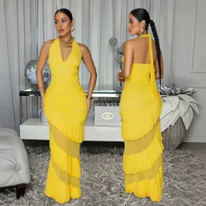Elegant yellow halter maxi dress with tiered ruffles and sleeveless backless design for women.