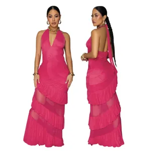 Detailed view of backless halter maxi dress with tiered ruffle mesh panels in bright pink color.