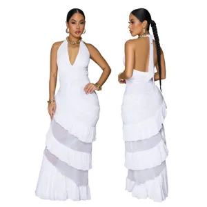 Elegant white halter neck maxi dress featuring deep V-neck, open back, and tiered ruffles.
