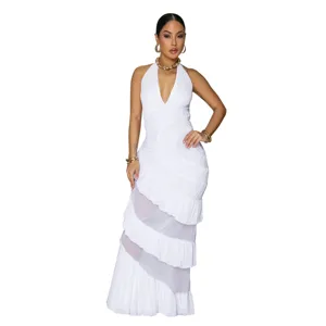 Stunning white halter neck tiered maxi dress detail, sleeveless design with sheer mesh panels.
