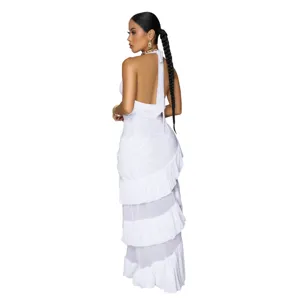 Sleeveless backless white maxi dress with halter neck and tiered ruffle design for elegant style.