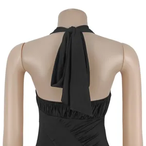 Detail view of a chic black sleeveless backless halter dress with elegant tie back design.