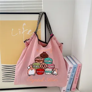 Cute embroidered canvas tote bag with dog and macaron design, large capacity casual shoulder bag.