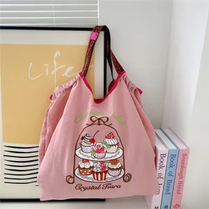 Cute pink canvas tote bag with embroidered cake design, casual shoulder bag for daily commuting.