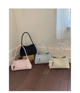 Korean style polka dot underarm handbag detail, chic commuter shoulder bag in multi colors.