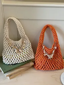 Chique holle geweven handtas met schelpenparelketting, perfect voor strandvakantie en dagelijks.