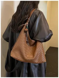 Retro bruine gewoven schoudertas voor dames, elegante stijl hobo tote bag detail opname.