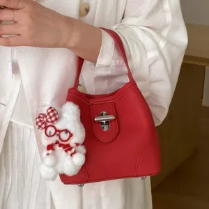 Red leather bucket bag for women, stylish top handle tote bag with cute rabbit pendant for daily.