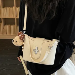 Stylish litchi grain bucket bag for women, versatile crossbody shoulder bag for daily commute.