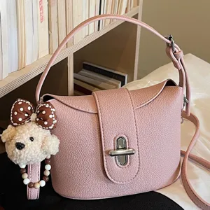 Trendy niche design pink leather bucket handbag for women, versatile crossbody shoulder bag.