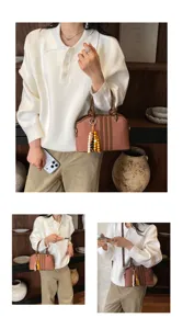 Detailed view of women's commuter handbag with bead charm, stylish vintage crossbody bag.