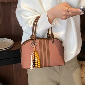 Stylish women canvas top handle bag with cute wooden bead charms for daily casual commute.