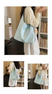Detailed view of the stylish light blue soft leather tote bag, perfect for daily commuting.