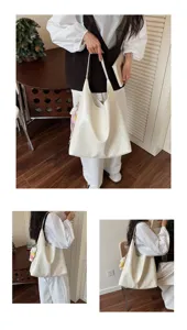 Stylish white soft leather hobo shoulder bag detailed view with cute plush charm in indoor setup.