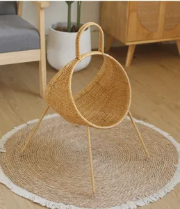 Close-up of creative woven rattan magazine holder detail in modern cozy living room setup.