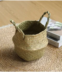 Natural straw woven basket detail view, foldable belly plant pot holder for home decor storage.