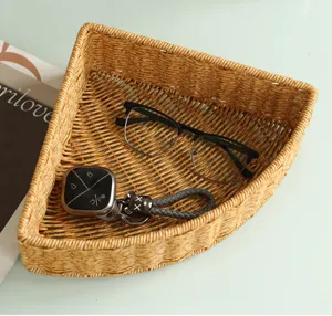 Rattan fan-shaped storage basket for desktop, coffee table snack organizer and home tidy.