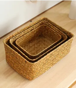 Close-up detail of woven storage basket, natural seagrass material for organizing tabletop items.