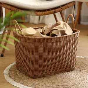 Imitation rattan woven laundry basket with handles for home bathroom and bedroom clothes storage.