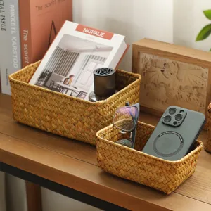 Natural woven straw storage basket rectangular desktop organizer for snacks and cosmetics.
