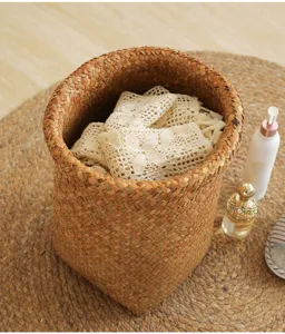 Handmade straw woven storage basket, natural wicker design for home organization and decor.