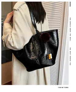 Retro oil wax leather commuter tote bag for women, large capacity casual shoulder bag.